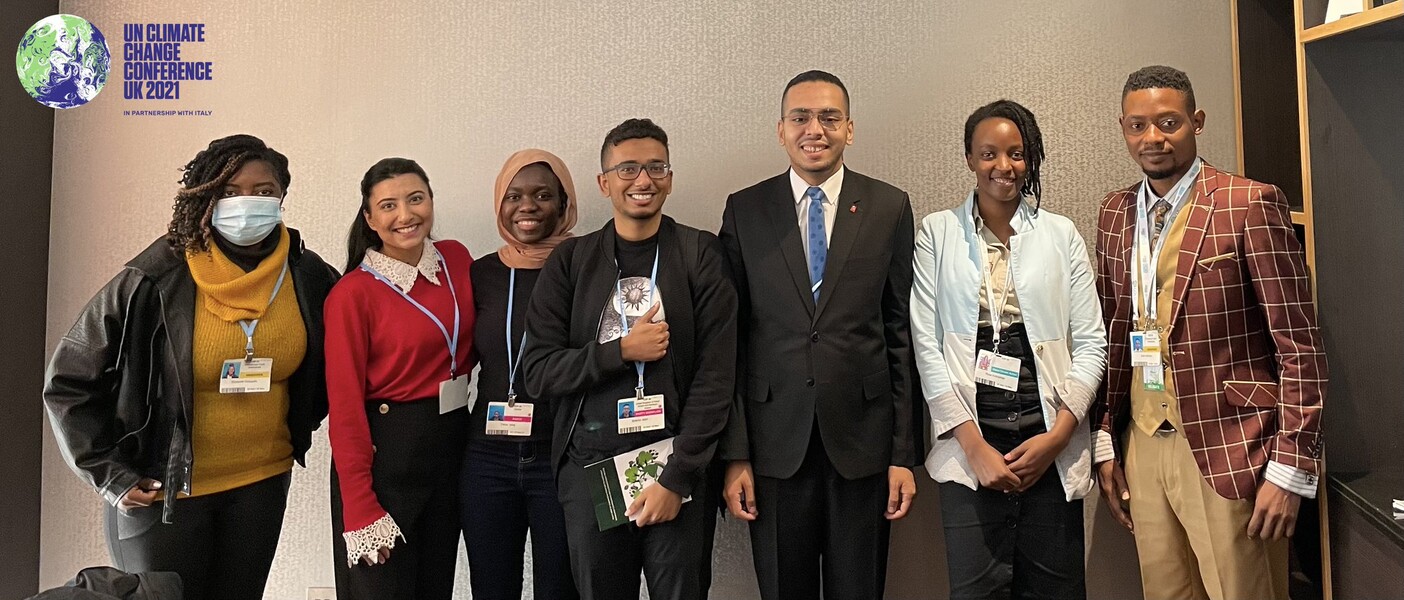 Anum Ahmed with young climate delegates at COP26 in Glasgow